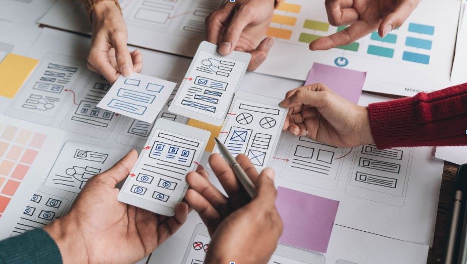 People working on a paper prototype.